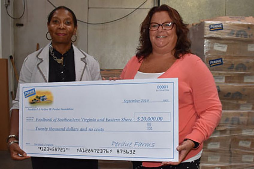 Bel Holden, human resources manager at Perdue s operations in Virginia, presents a US$20,000 Perdue Foundation grant to Charmin Horton of the Foodbank of Southeastern Virginia and the Eastern Shore to help fund its backpack programme on the Eastern Shore. Perdue also donated 44,000 pounds of protein to support the Foodbank programmes. Photo: Perdue