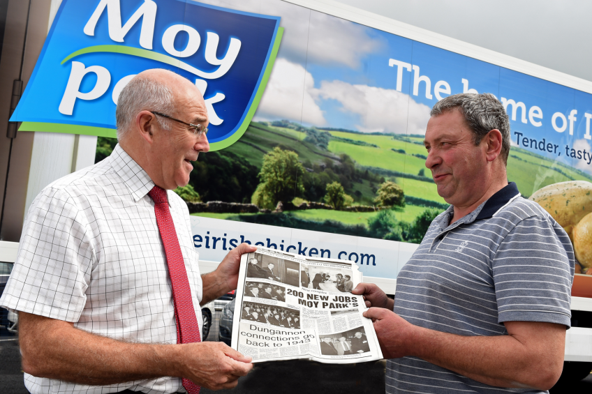 Moy Park Dungannon general mManager, Ronnie Newell and employee Derek Hazleton, who this year celebrated 40 years' long service, reminisce with some news clippings from the factory opening in 1975.