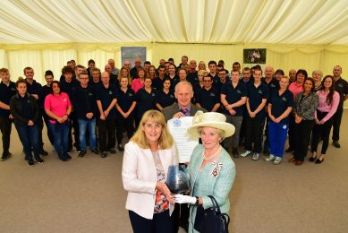 David & Helen Brass receive their award from Claire Hensman, Cumbria s Lord Lieutenant with staff helping celebrate.