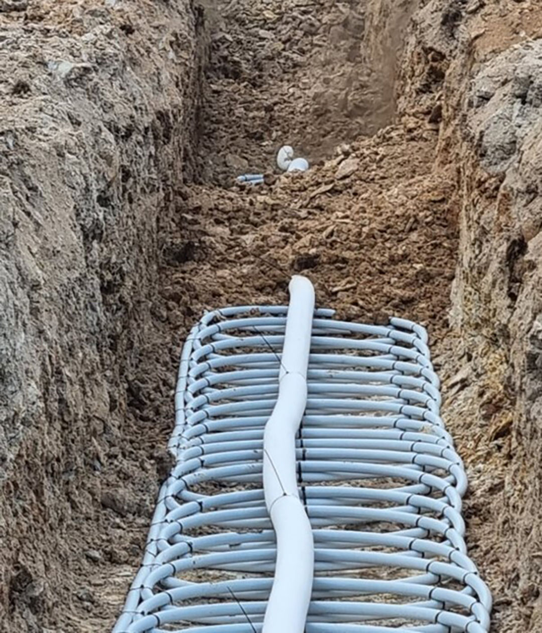 Backfilling the ground loops. Photo: Ground Source Systems